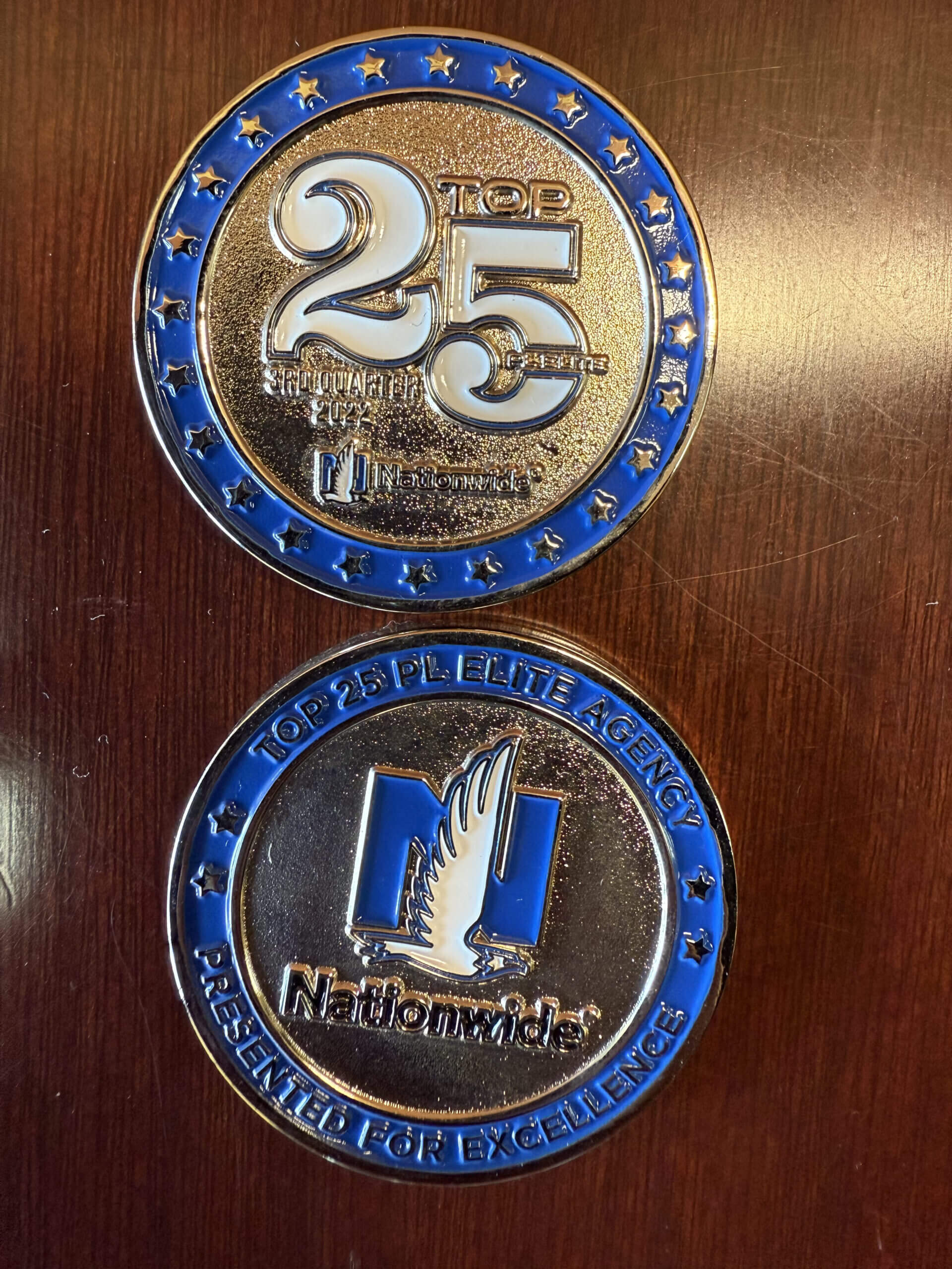 Silver and blue Nationwide award coins