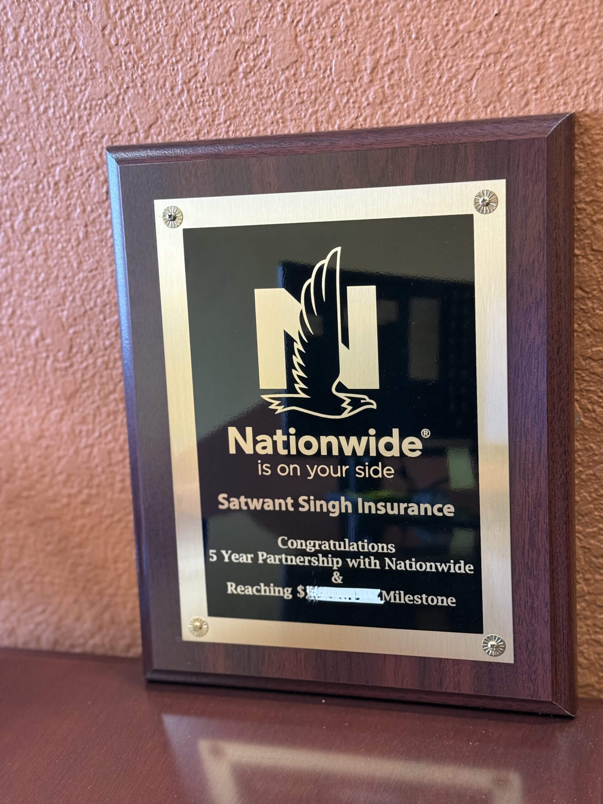 Commemorative plaque for insurance milestone