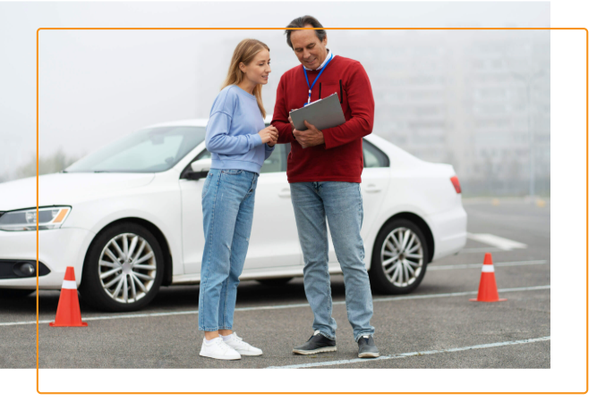 Driving instructor and student by white car