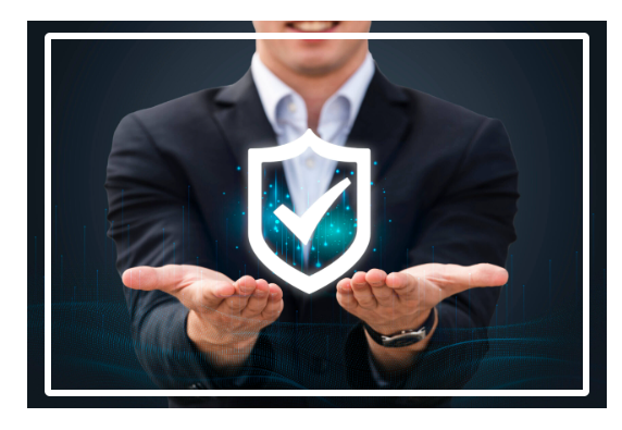 Person in suit holding glowing security shield