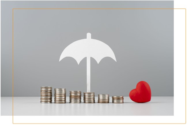 Stacks of coins under umbrella and heart