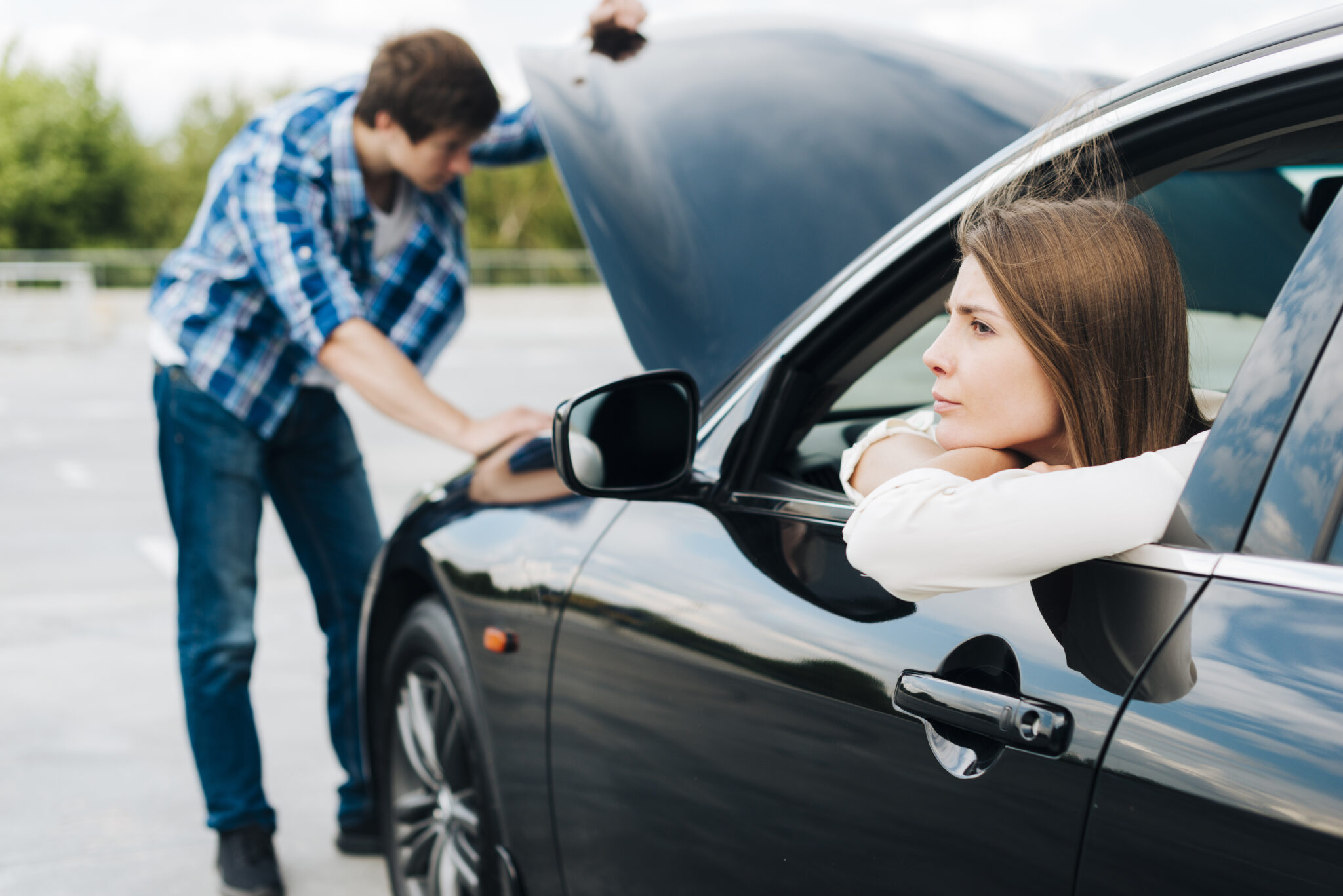 Couple dealing with car trouble