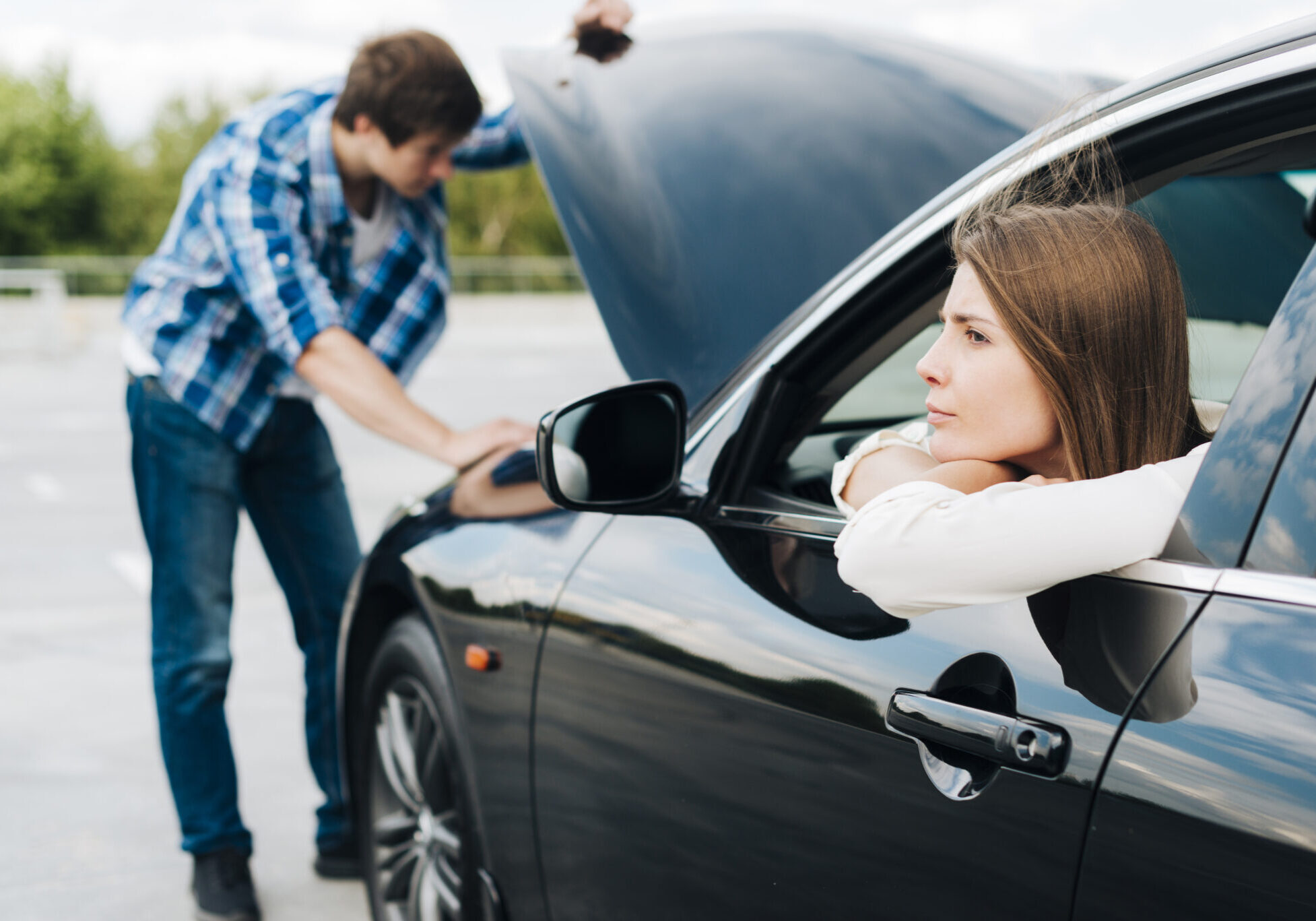 Couple dealing with car trouble